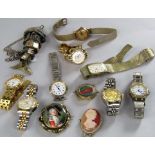A box of various vintage wrist watches to include reproduction Rolex and Cartier; together with a