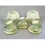 A quantity of Grafton China Blossoms pattern art deco tea wares in green and gilt colourway