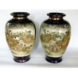 A pair of late 19th century Satsuma vases of ovoid form with painted and gilded decoration of male