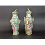 A pair of 19th century Cantonese vases and covers with polychrome painted female character