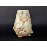 A Clarice Cliff vase with moulded and painted magnolia decoration of a buff coloured ground, printed