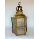 Sheet metal and coloured glass hall lantern with crown shaped finial, 41 cm high