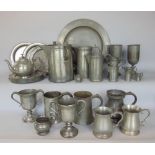 A large collection of antique and later pewter to include an impressive twin handled jug and others