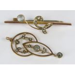A 9ct art nouveau drop pendant set with seed pearls and goshenite, together with a matching bar