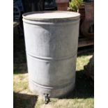 A large galvanised barrel with brass screw cap and pronounced tap, 56cm in diameter x 84cm high