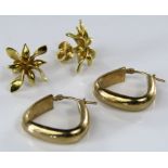 A pair of 18ct stud earrings of stylised flower form with screw fastenings, together with a