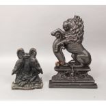 A cast iron door stop in the form of a rampant lion together with a further door stop in the form of