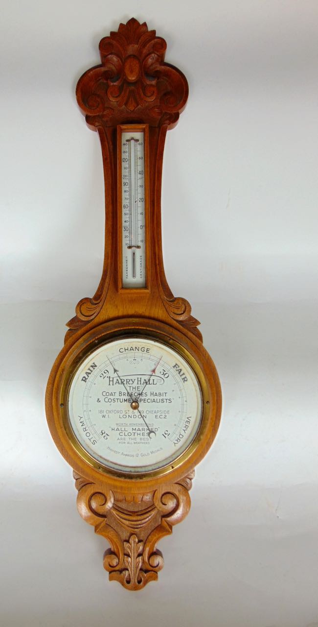 Oak banjo barometer thermometer, the dial inscribed 'Harry Hall Ltd, The Coat Breaches Habit and