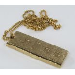 A 9ct necklace with ingot pendant, 32.5g