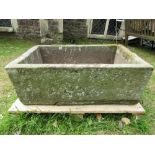 A natural stone trough of rectangular form 88 cm long x 57 cm wide x 32 cm high approx (2 sections