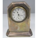 1920s silver desk clock, fitted with a watch head, with canted corners upon a stepped base, maker
