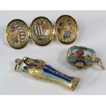 Egyptian revival interest - Two hinged '800' silver gilt charms with enamel decoration; the first of