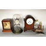 A collection of vintage time pieces to include an antique torsion clock under a glass dome, a