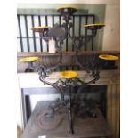 A good quality cast iron garden/conservatory planter with C scroll frame supporting six flower