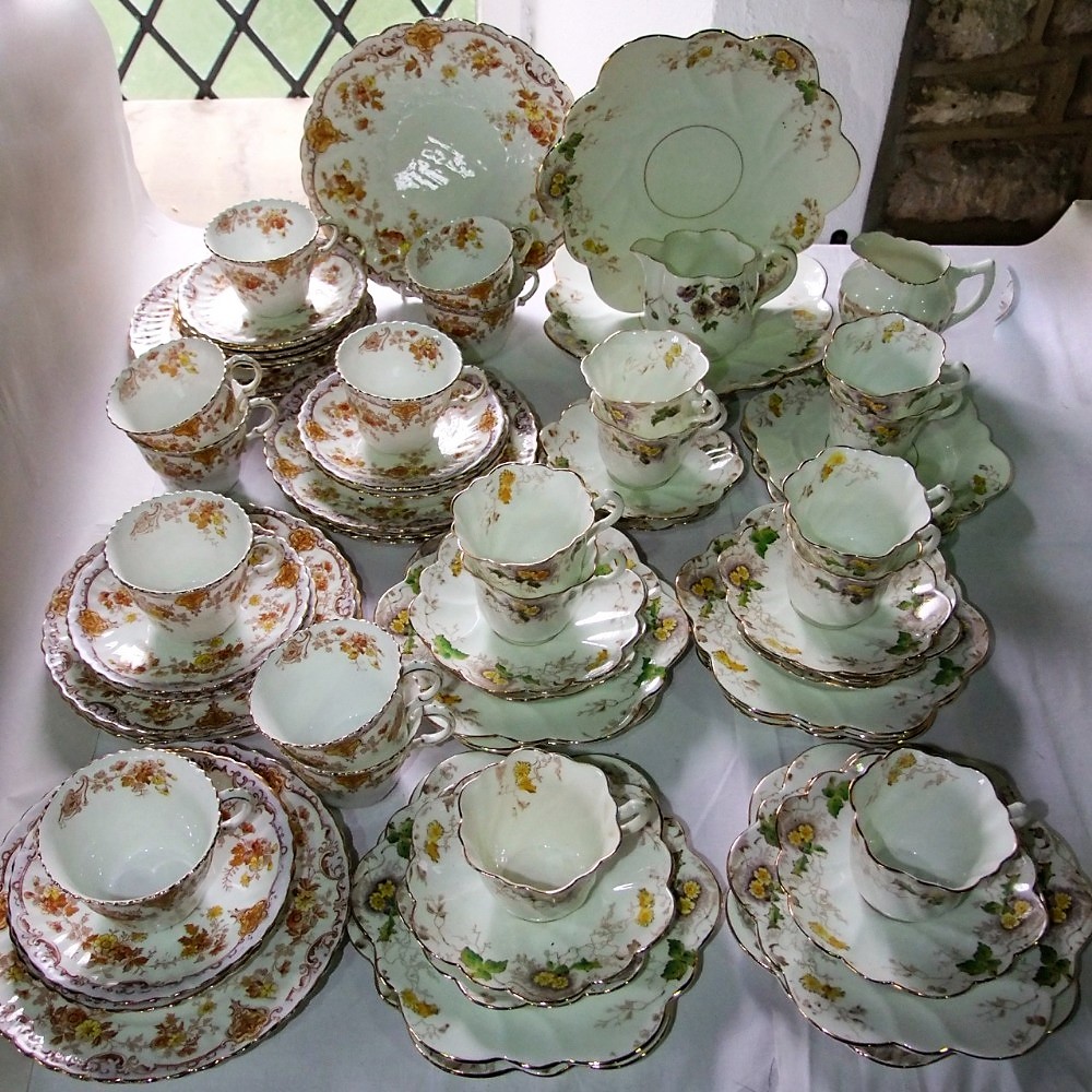 A collection of late 19th century teawares of wrythen moulded form comprising a pair of cake plates,