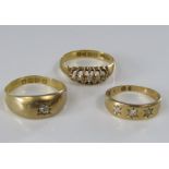 Three diamond set gold rings; two in 18ct gold and one with indistinct mark, 7g total