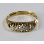 An 18ct five stone diamond ring, central stone 0.15cts approx, size Q, 3.5g