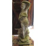 A weathered contemporary cast composition stone garden statue in the form of a maiden rising from