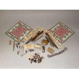 A mixed collection including a string of 19th century ivory beads, pens, beadwork pouch, sea