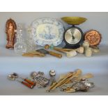 A box of interesting items to include fish and jelly moulds, treen kitchenalia, silver backed