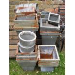 A quantity of approximately thirty contemporary tin planters of varying size and design to include