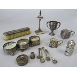 A mixed collection of silver to include a four piece cruet set comprising three salts and a lidded