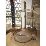 A brass weighing scale, with rectangular mahogany platform base, together with a Salters spring