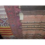 A mixed collection of eastern rugs, to include a Kelim rug, a further flat weave runner and a