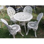 A Victorian cream painted cast aluminium garden terrace table of circular form with decorative