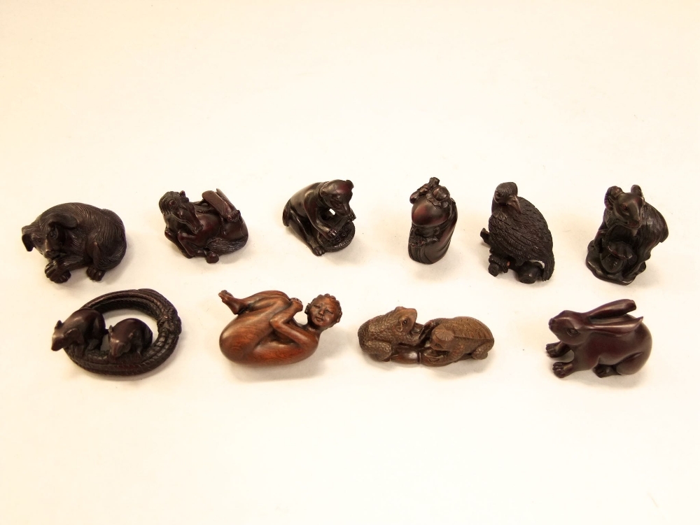 A collection of ten various carved Japanese netsuke and okimono's mainly in the form of animals, the