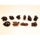 A collection of ten various carved Japanese netsuke and okimono's mainly in the form of animals, the
