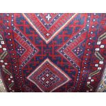 A Meshwari runner principally in a red and blue colourway, the five medallion centre within a