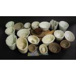 A quantity of 19th and early 20th century ceramic jelly moulds, various designs, including