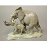 A Lladro group of a mother and baby elephant - Maternal Elephant, number 4765, 19 cm tall approx (