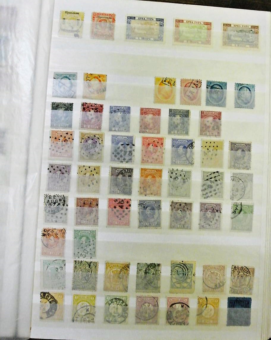 A world stamps collection in two stockbooks including Belgium, The Netherlands, Portugal, Romania,