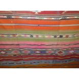 Kelim flat weave carpet with alternating striped colourful decoration and various diaper bands,