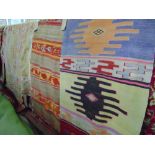 Three various colourful Kelim flat weave rugs and runners, with typical colourful decoration,