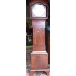 A Regency mahogany Scottish longcase clock, the trunk with inlaid detail, arched hood with spiral