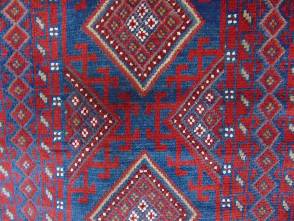 A Meshwari wool runner with multi medallion centre within alternating borders principally in a