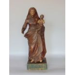 An antique carved limewood and gesso study of the Madonna and Child upon a wooden plinth base,