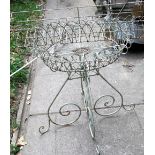 A decorative light steel and wirework conservatory/garden planter with circular shallow basket