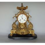 A two train French drumhead mantle clock, with fancy gilt spelter case, fitted with birds, oval