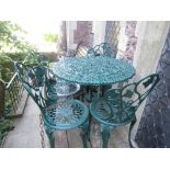 A Victorian style green painted cast aluminium five piece garden terrace set comprising table with