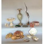 A box of interesting items to include soapstone carvings, shells, together with a carved hardstone
