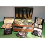 A part oak canteen of cutlery fitted with recessed handles, together with further boxed flatware,