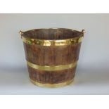 Antique oak and brass bound bucket, 27cm high