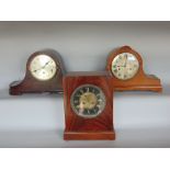 An interesting flame mahogany mantle clock, with ebonised chapter ring, open escapement and gilt