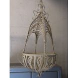 A pair of decorative contemporary ironwork hanging baskets with lattice scroll and further