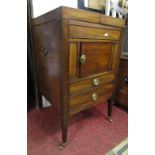 A Georgian mahogany washstand of square cut form with twin brass hinged lid revealing cut out