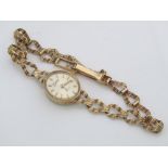 A ladies 9ct cocktail watch with fancy gold bracelet, 8 grams gross